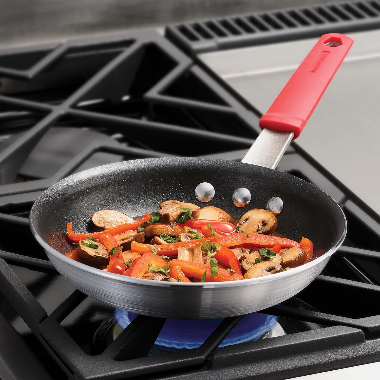image:imageTramontina Professional 12Inch Non Stick Large Frying Pan HeavyGauge Aluminum Skillet with Reinforced Nonstick Coating Red Handle Dishwasher and Oven SafeNonstick Red handle